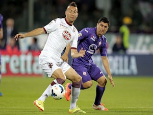 David Pizarro of ACF Fiorentina fights for the ball with Omar El Kaddouri of Torino FC during the Serie A match on May 18, 2014