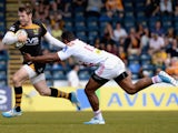 Elliot Daly of London Wasps tackled by Waisea Vuidravuwalu of Stade Francais Paris during the European Rugby Champions Cup play-off first leg match on May 18, 2014