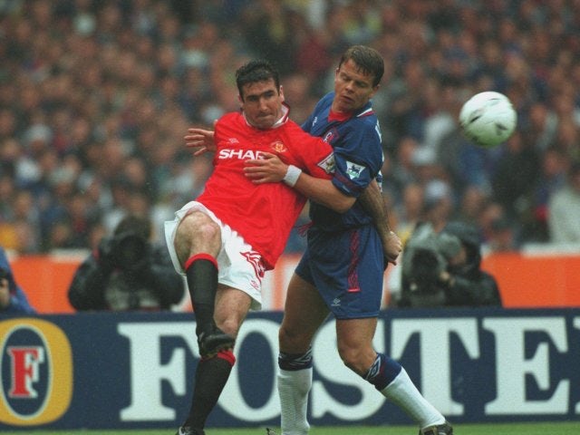 Manchester United striker Eric Cantona passes the ball during the FA Cup final on May 14, 1994.