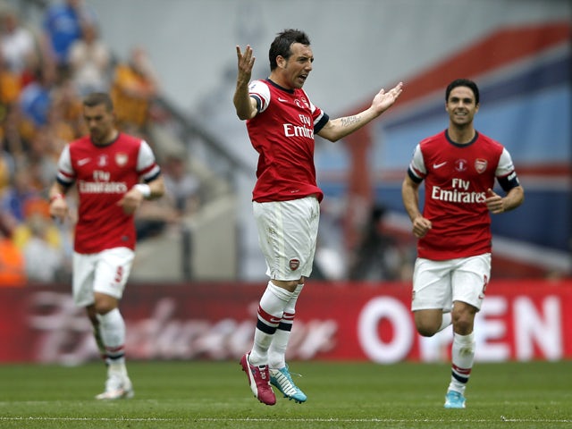 Arsenal's Spanish midfielder Santi Cazorla celebrates scoring his team's first goal during the English FA Cup final match between Arsenal and Hull City at Wembly Stadium in London on May 17, 2014