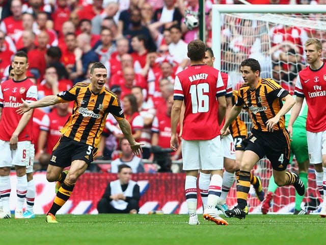 James Chester of Hull City celebrates as he scores their first goal during the FA Cup with Budweiser Final match between Arsenal and Hull City at Wembley Stadium on May 17, 2014