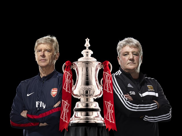Aresnal manager Arsene Wenger and Hull City manager Steve Bruce pose with the FA Cup trophy ahead of the 2014 final