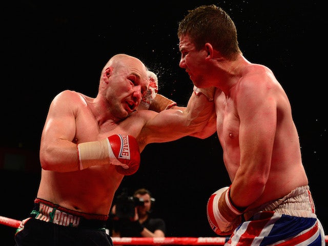 Gavin Rees (L) in action against Gary Buckland during their Lightweight bout at the Motorpoint Arena on May 17, 2014