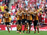 Curtis Davies of Hull City celebrates with team mates as he scores their second goal during the FA Cup with Budweiser Final match between Arsenal and Hull City at Wembley Stadium on May 17, 2014