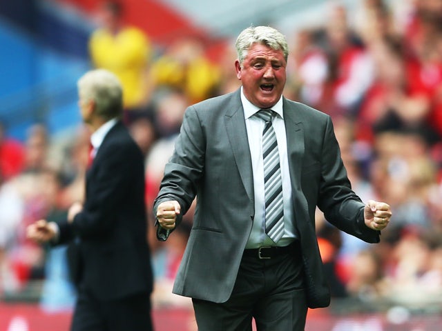 Steve Bruce, manager of Hull City celebrates during the FA Cup with Budweiser Final match between Arsenal and Hull City at Wembley Stadium on May 17, 2014