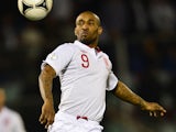 England's Jermain Defoe eyes the ball during the World Cup 2014 qualifying football match between San Marino and England at Serravalle Stadium in San Marino on March 22, 2013