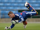 Jos Buttler takes a catch during an England training session on September 05, 2013.