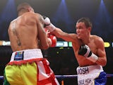 Josh Warrington lands a right hand on Rendall Munroe during the Commonwealth Featherweight Title fight between Josh Warrington and Rendall Munroe at MEN Arena on April 19, 2014