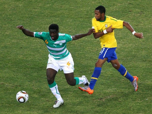 Ivory Coast centre-back Kolo Toure keeps possession from Brazilian attacker Robinho on June 20, 2010.
