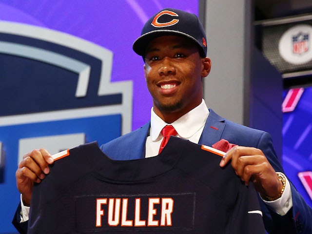 Kyle Fuller of the Virginia Tech Hokies poses with a jersey after he was picked #14 overall by the Chicago Bears during the first round of the 2014 NFL Draft  on May 8, 2014