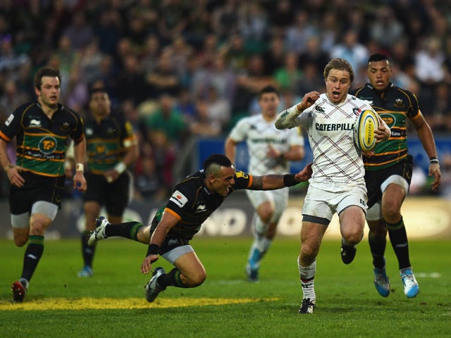 Mathew Tait of Leicester Tigers avoids a tackle from Kahn Fotuali'i of Northampton Saints during the Aviva Premiership Semi Final match between Northampton Saints and Leicester Tigers at Franklin's Gardens on May 16, 2014