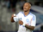 Marseille's Ghanaian forward Andre Ayew jubilates after scoring, during the French L1 football match between Marseille (OM) and Guingamp at the Velodrome stadium in Marseille on May 17, 2014