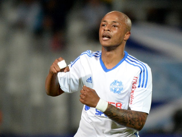 Marseille's Ghanaian forward Andre Ayew jubilates after scoring, during the French L1 football match between Marseille (OM) and Guingamp at the Velodrome stadium in Marseille on May 17, 2014