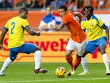 Dutch national team player Memphis Depay vies with Ecuador's Jorge Guagua and Juan Paredes during the friendly football match between Holland and Ecuador in Amsterdam, the Netherlands, on May 17, 2014