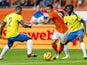 Dutch national team player Memphis Depay vies with Ecuador's Jorge Guagua and Juan Paredes during the friendly football match between Holland and Ecuador in Amsterdam, the Netherlands, on May 17, 2014