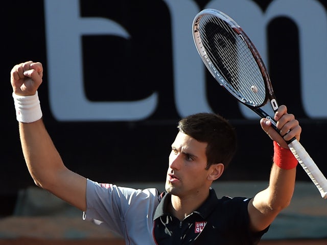 Novak Djokovic of Serbia celebrates after winning the ATP-WTA Rome's Tennis Masters semi-final against Milos Raonic of Canada on May 17, 2014