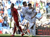 Real Madrid's forward Alvaro Morata celebrates with Real Madrid's defender Sergio Ramos after scoring his team's second goal during the Spanish league football match Real Madrid CF vs RCD Espanyol at the Santiago Bernabeu stadium in Madrid on May 17, 2014
