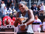 Serena Williams of USA celebrates with the winners trophy after defeating Sara Errani of Italy in the final during day eight of the Internazionali BNL d'Italia  on May 18, 2014