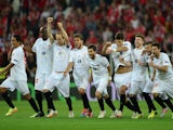 Sevilla players celebrate after Kevin Gameiro of Sevilla (not pictured) scores the winning penalty in the shoot out during the UEFA Europa League Final match on May 14, 2014