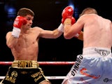 Stephen Smith in action with Gary Buckland during their British Super-Featherweight Championship bout at Motorpoint Arena on August 17, 2013