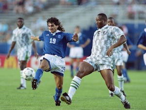 Nigerian defender Uche Okechukwu makes a clearance against Greece on June 30, 1994.