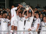 AC Milan's team poses with the trophy after winning the Champions League football match against Liverpool at the Olympic Stadium, in Athens, 23 May 2007