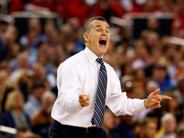 Head coach Billy Donovan of the Florida Gators motions to his players during the NCAA Men's Final Four Semifinal against the Connecticut Huskies at AT&T Stadium on April 5, 2014