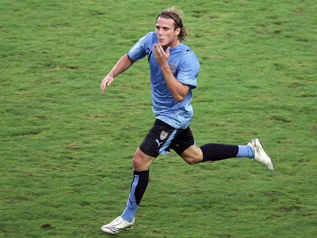 Former Manchester United striker Diego Forlan celebrates scoring Uruguay on July 07, 2007.