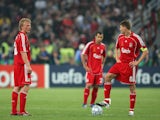 Dirk Kuyt and Steven Gerrard of Liverpool prepare to re-start following the the first goal by Milan during the UEFA Champions League Final match on May 23, 2007