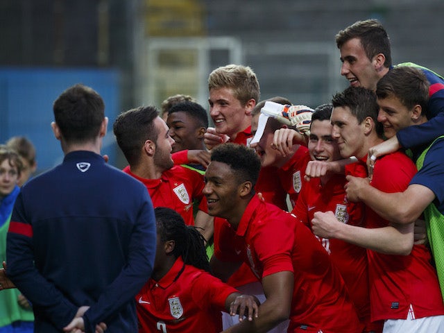 Players of England celebrate after the UEFA U17 Championship Qualifier Elite Round match between Italy and England on March 31, 2014