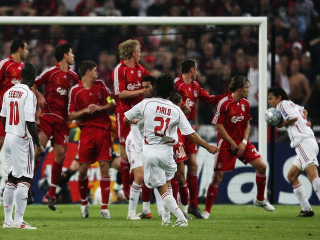 Filippo Inzaghi (R #9) of Milan deflects the ball into the net to score the opening goal during the UEFA Champions League Final match on May 23, 2007