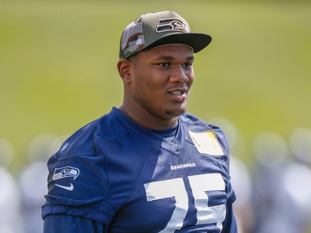 Tackle Garrett Scott #75 of the Seattle Seahawks looks on during Rookie Minicamp at the Virginia Mason Athletic Center on May 17, 2014