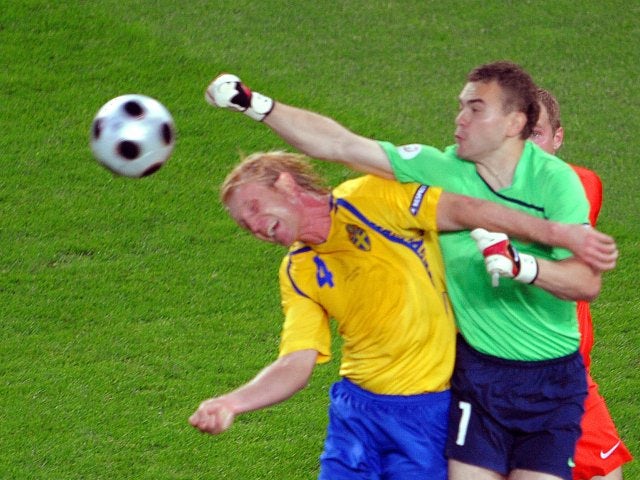 Russia goalkeeper Igor Akinfeev punches clear the danger against Sweden on June 18, 2008.