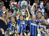 Inter Milan's players celebrate with the trophy after winning the UEFA Champions League final football match Inter Milan against Bayern Munich at the Santiago Bernabeu stadium in Madrid on May 22, 2010