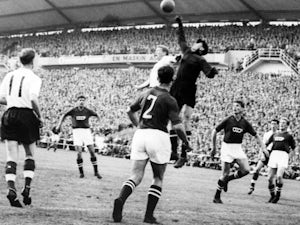 Soviet Union goalkeeper Lev Yashin punches clear against England on June 98, 1958.