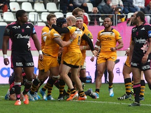 Guy Thompason of Wasps celebrates with team mates after scoring the teams second try during the European Rugby Champions Cup Play-off match between Stade Francais Paris and London Wasps at Stade Jean-Bouin on May 24, 2014