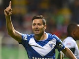Argentina's Velez Sarfiield's player Mauro Zárate celebrates after scoring against Colombia's La Equidad during their Copa Sudamericana 2013 match on September 17, 2013