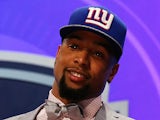 Odell Beckham Jr of the LSU Tigers poses with a jersey after he was picked #12 overall by the New York Giants during the first round of the 2014 NFL Draft  on May 8, 2014