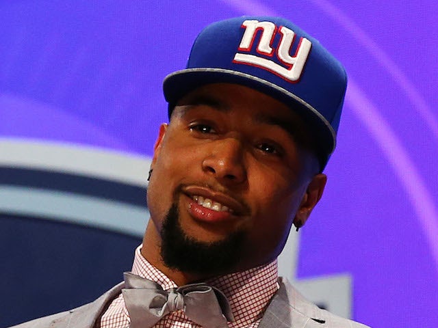 Odell Beckham Jr of the LSU Tigers poses with a jersey after he was picked #12 overall by the New York Giants during the first round of the 2014 NFL Draft  on May 8, 2014