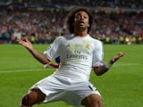 Marcelo of Real Madrid reacts after Gareth Bale of Real Madrid scored their second goal during the UEFA Champions League Final between Real Madrid and Atletico de Madrid at Estadio da Luz on May 24, 2014
