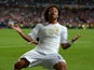 Marcelo of Real Madrid reacts after Gareth Bale of Real Madrid scored their second goal during the UEFA Champions League Final between Real Madrid and Atletico de Madrid at Estadio da Luz on May 24, 2014