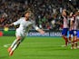 Sergio Ramos of Real Madrid celebrates scoring their first goal in stoppage time during the UEFA Champions League Final between Real Madrid and Atletico de Madrid at Estadio da Luz on May 24, 2014