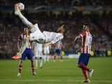 Real Madrid's defender Sergio Ramos jumps to kick the ball during the UEFA Champions League Final Real Madrid vs Atletico de Madrid at Luz stadium in Lisbon, on May 24, 2014