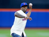 Rap artist 50 Cent throws the ceremonial first pitch of a game between the New York Mets and the Pittsburgh Pirates at Citi Field on May 27, 2014