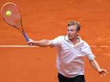 Andrey Golubev of Kazakhstan plays a volley against Nicolas Almagro of Spain during day four of the Mutua Madrid Open tennis tournament at the Caja Magica on May 6, 2014