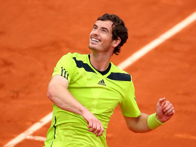 Andy Murray of Great Britain celebrates victory in his men's singles match against Marinko Matosevic of Australia on day five of the French Open at Roland Garros on May 29, 2014