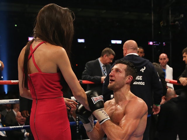 Carl Froch of England proposes following his victory against George Groves of England during their IBF and WBA World Super Middleweight title fight at Wembley Stadium on May 31, 2014
