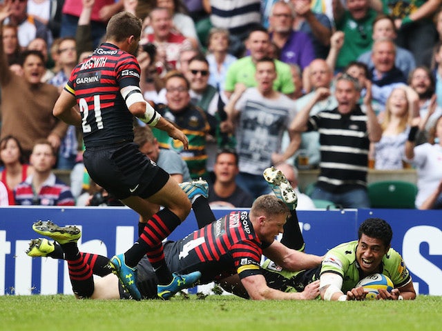 Chris Ashton of Saracens fails to stop George Pisi of Northampton Saints scoring their second try during the Aviva Premiership Final at Twickenham on May 31, 2014 