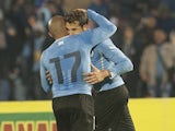 Uruguay's Cristhian Stuani and Arevalo Rios celebrate after scoring against Northern Ireland during their friendly football match at Centenario Stadium in Montevideo on May 30, 2014