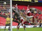 The ball goes over Burton Albion's English goalkeeper Dean Lyness (L) during the English League 2 Play-Off final football match between Burton Albion and Fleetwood Town on May 26, 2014